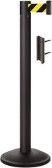 Lavi Industries - 38-1/2" High, 2-3/4" Pole Diam, Stanchion - 12-1/2" Base Diam, Round Steel Base, Black Steel Post, 7' x 2" Tape, Single Line Tape - USA Tool & Supply