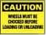 NMC - "Caution - Wheels Must Be Chocked Before Loading and Unloading", 10" Long x 14" Wide, Pressure-Sensitive Vinyl Safety Sign - Rectangle, 0.004" Thick, Use for Accident Prevention - USA Tool & Supply