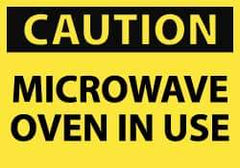 NMC - Accident Prevention Label, Header: CAUTION - Legend: Caution - Microwave Oven in Use, English, Black & Yellow, 5" Long x 3" High, Sign Muscle Finish - USA Tool & Supply